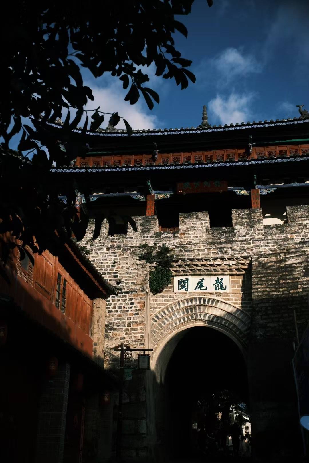Old stone streets and historic doorway in Longweiguan, Dali